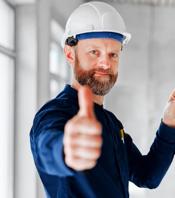 Experienced plumber giving thumbs up